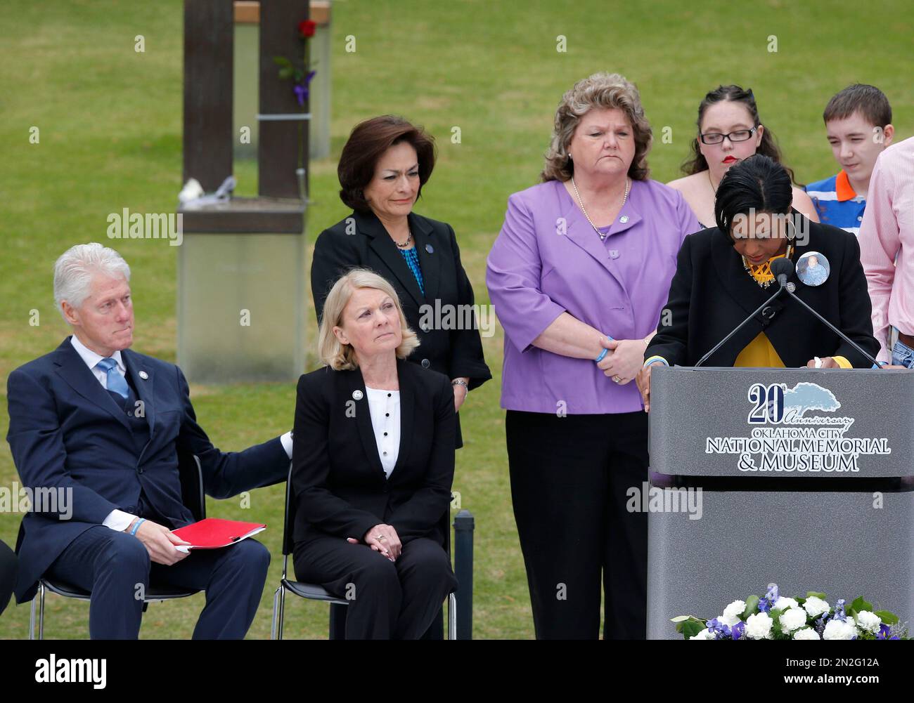 Helena Garrett, right, mother of bombing victim Tevin Garrett, breaks