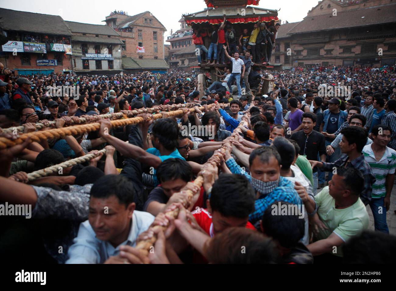 Nepalese devotees pull ropes tied to the chariot of Hindu god Bhairava