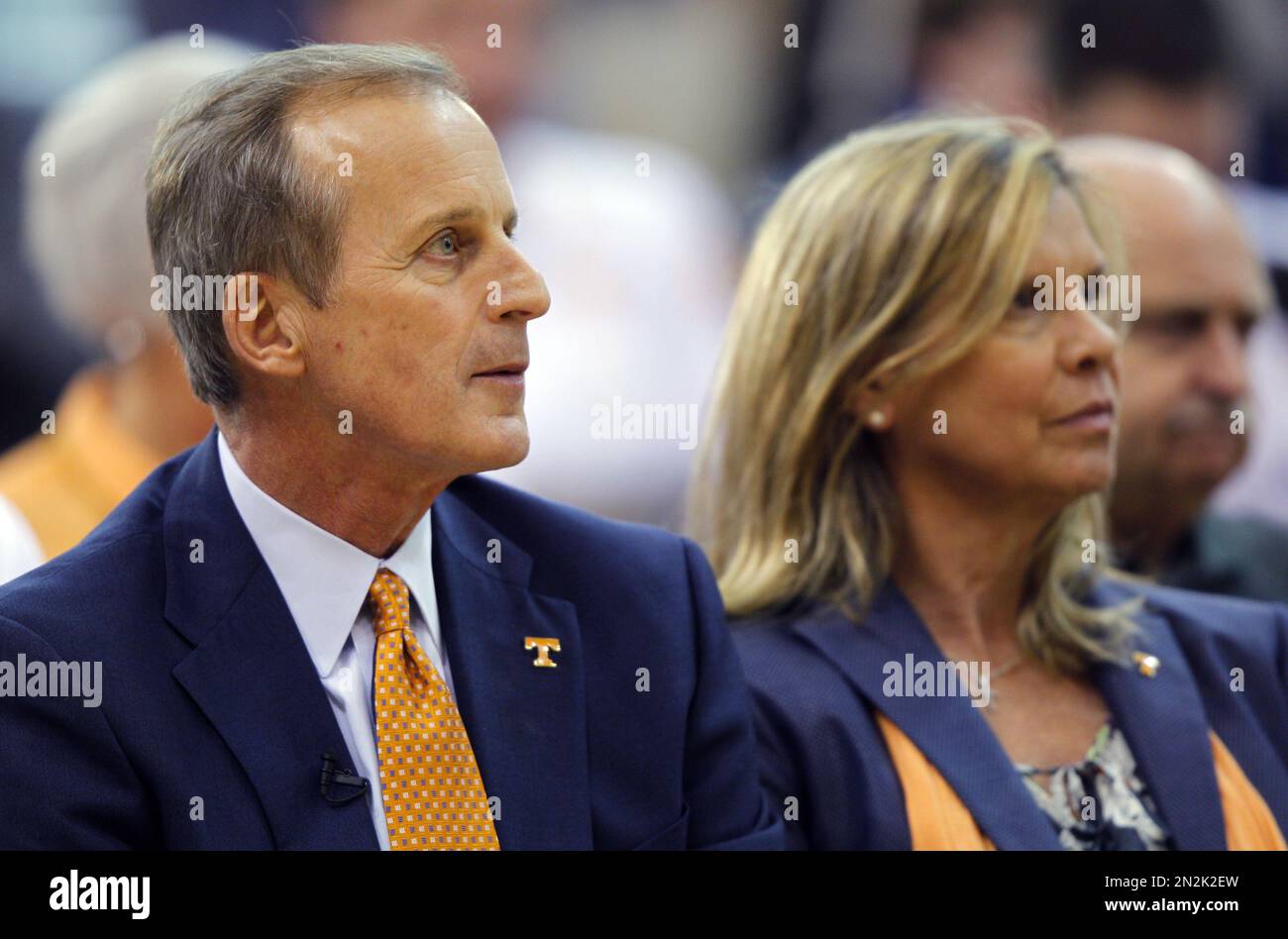 Former University of Texas head basketball coach Rick Barnes, left