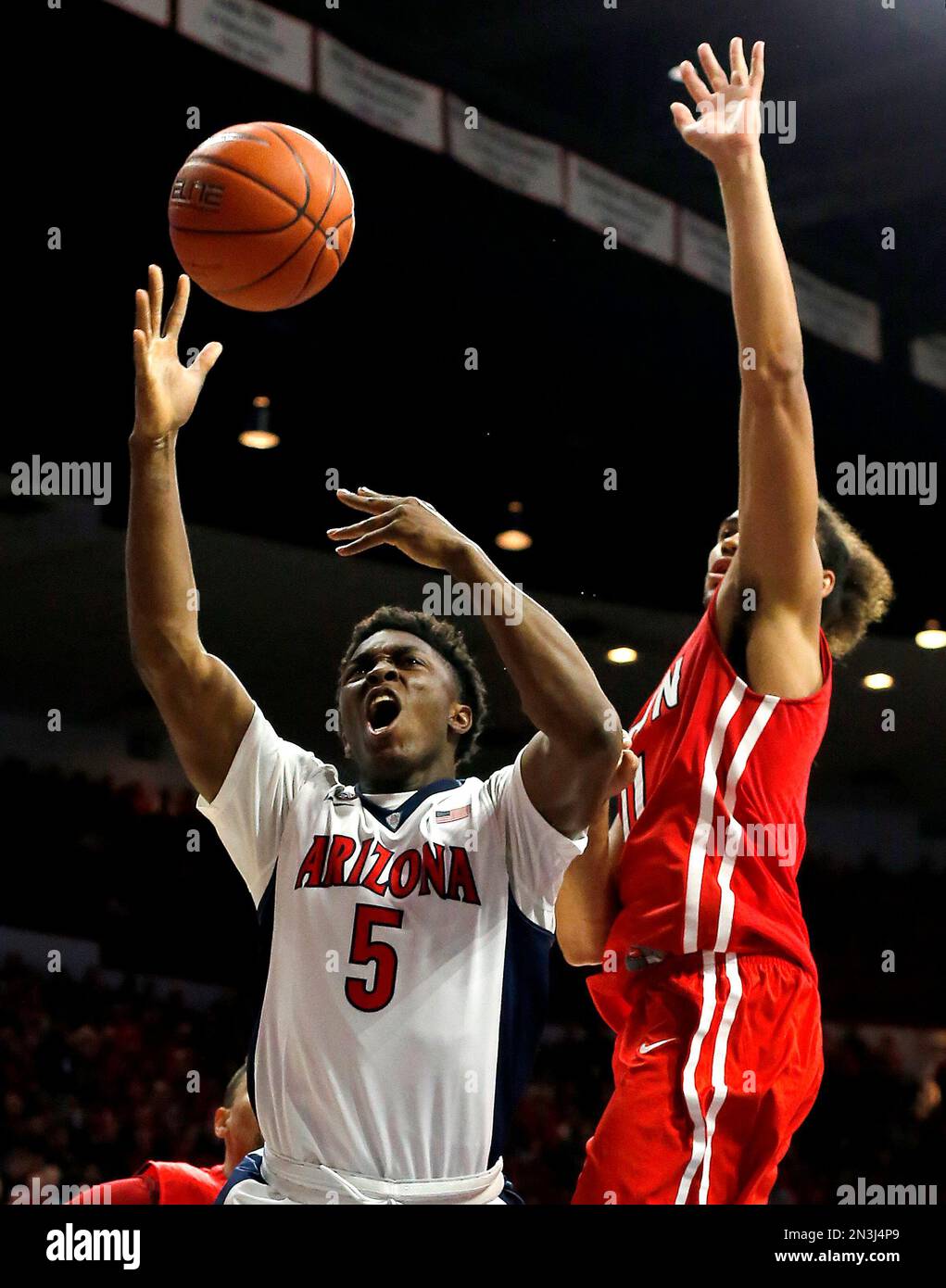 Arizona forward Stanley Johnson (5) draws the foul from Cal State