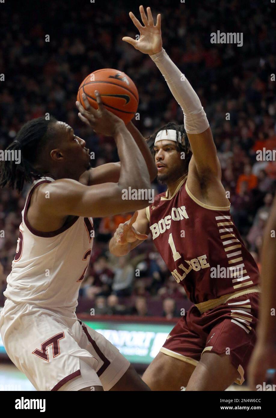 Virginia Tech's Justyn Mutts, left, is defended by Boston College's T.J