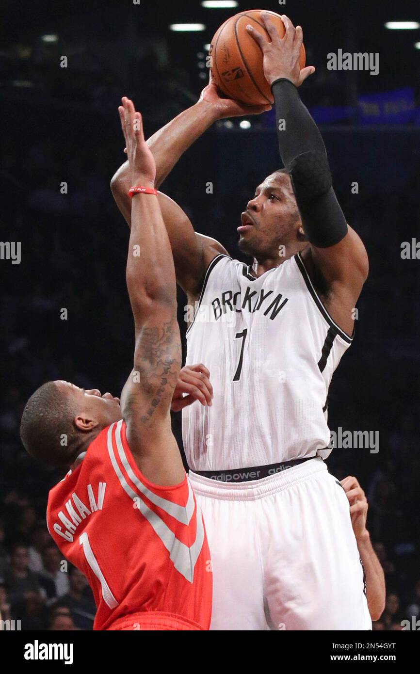 Brooklyn Nets guard Joe Johnson (7) shoots over Houston Rockets guard