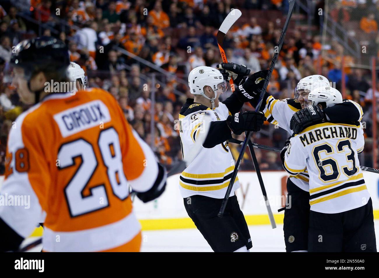 From right to left, Boston Bruins' Brad Marchand, Andrej Meszaros, of