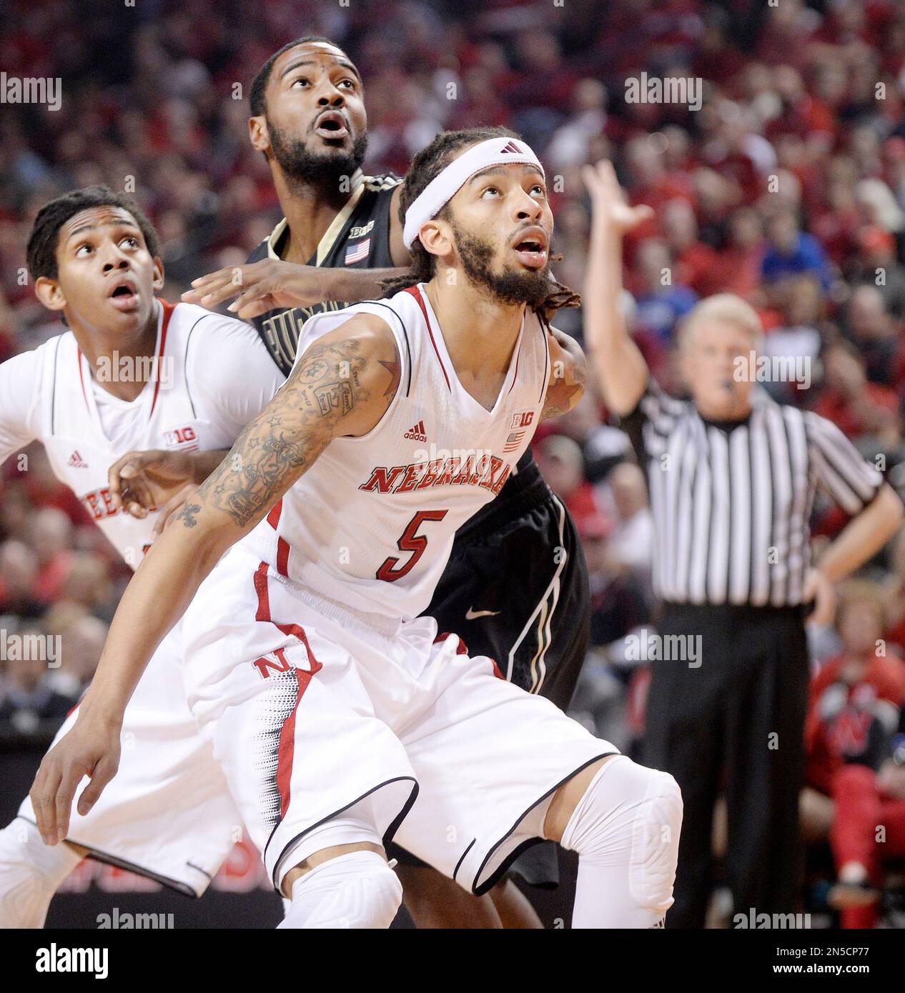 Nebraska forward David Rivers, left, Purdue guard Terone Johnson