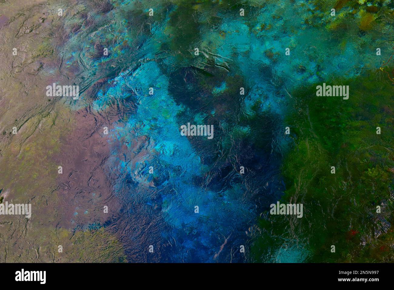 El fondo abstracto está hecho por el agua colorida de la primavera de Blue Eye, Albania. Foto de stock