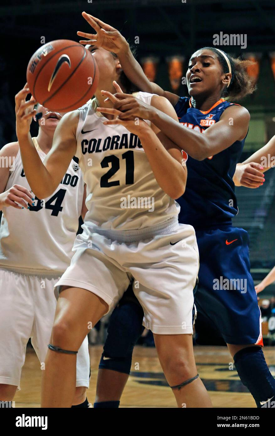 Illinois' Taylor Tuck, right, strips the ball from Colorado's Jasmine Sborov (21) during the