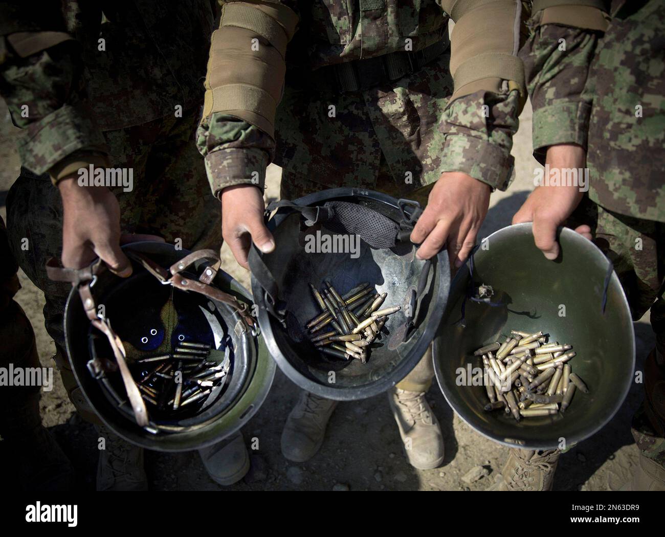 In this Tuesday, Nov. 26, 2013 photo, Afghan army soldiers show their