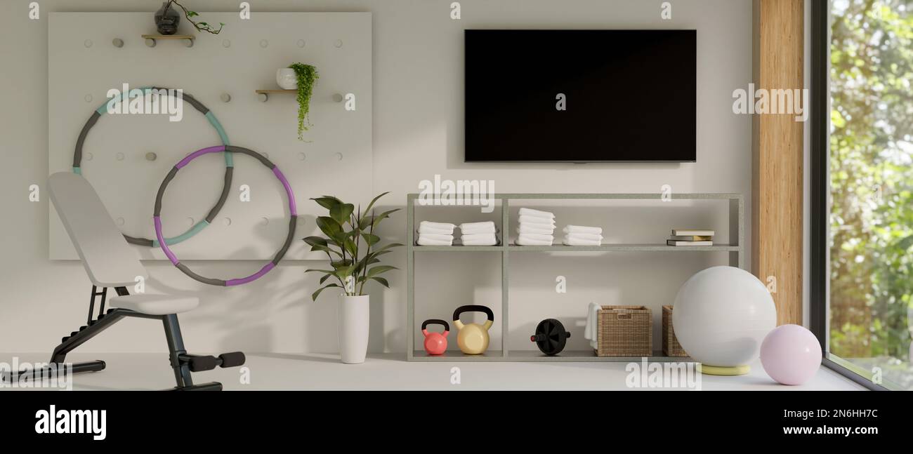 Diseño interior de sala de fitness en casa moderna con pantalla de TV en la  pared blanca, hula hoop, banco deportivo, pelota de yoga, campanas de  hervidor de agua y decoración. 3d