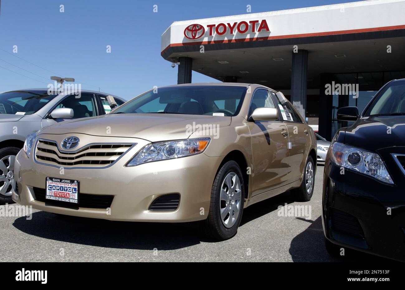 FILE In this Aug. 30, 2011 file photo, 2012 Toyota Camrys are parked