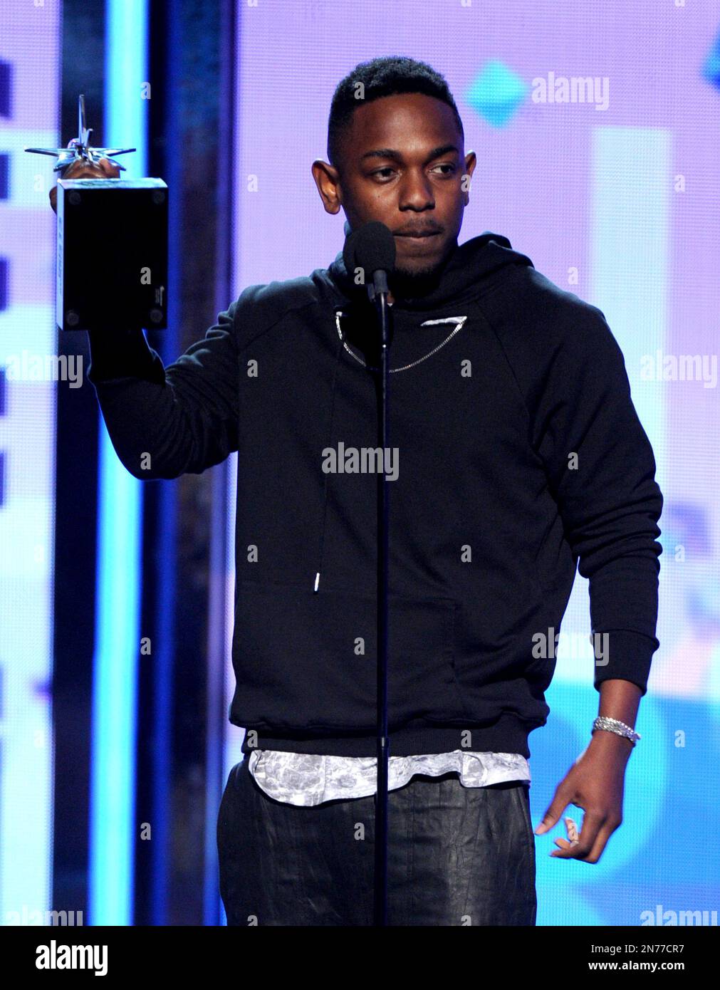 Kendrick Lamar accepts the award for best male hip hop artist at the
