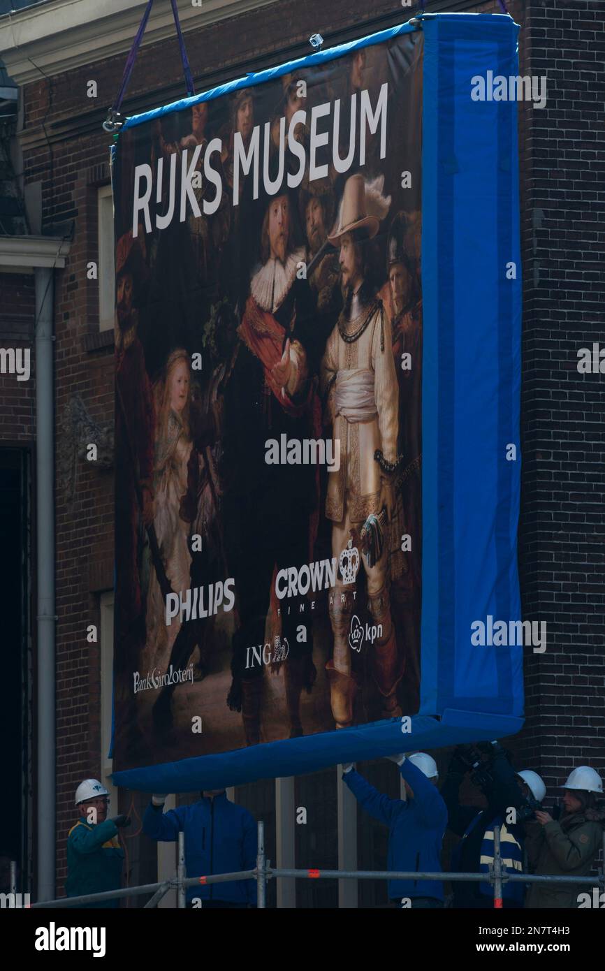 Workers guide a wooden crate containing Dutch master Rembrandt's famous