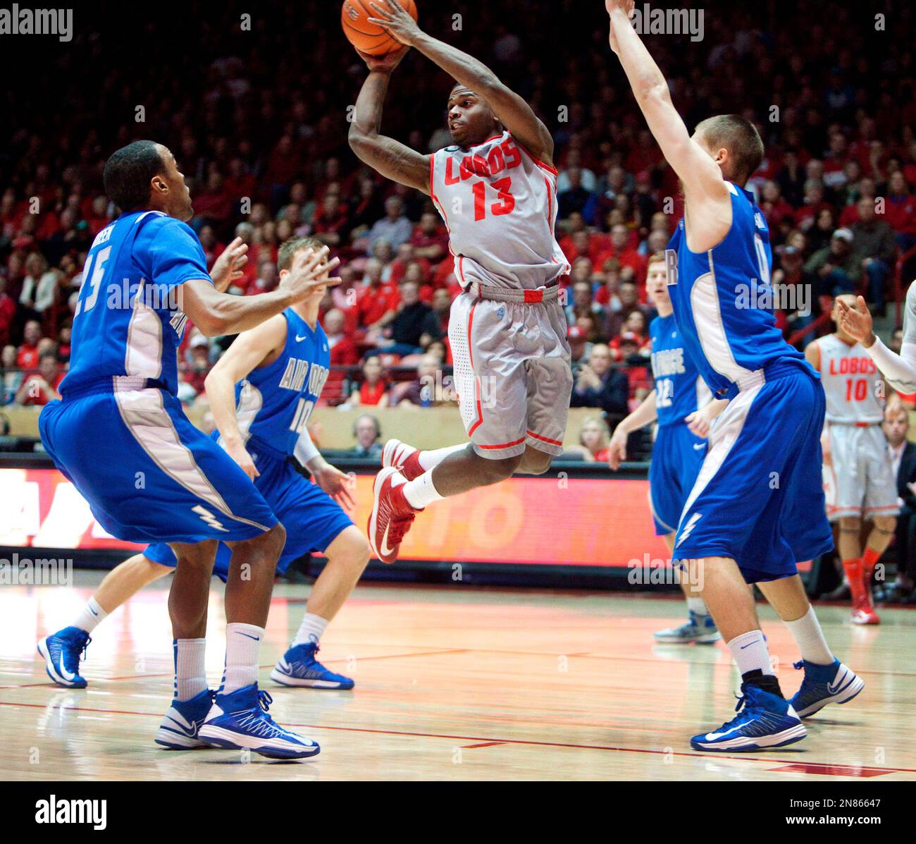 New Mexico's Jamal Fenton (13) looks to pass the ball against Air Force