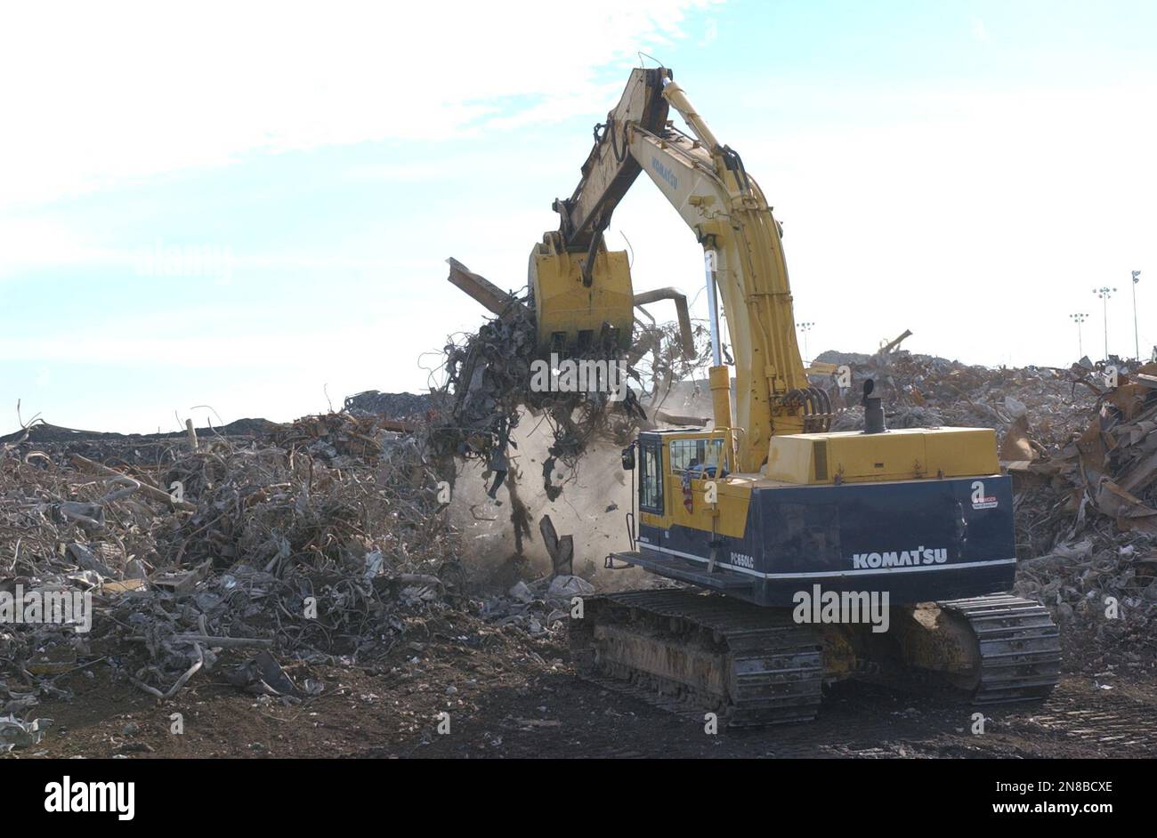 An excavator sifts through mounds of debris from the World Trade Center attacks at the Fresh