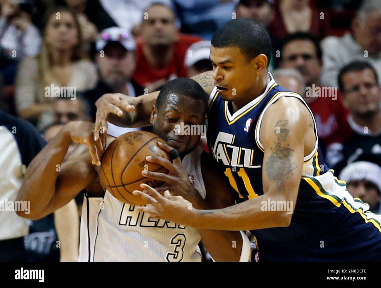 Utah Jazz's Earl Watson (11) pressures Miami Heat's Dwyane Wade during
