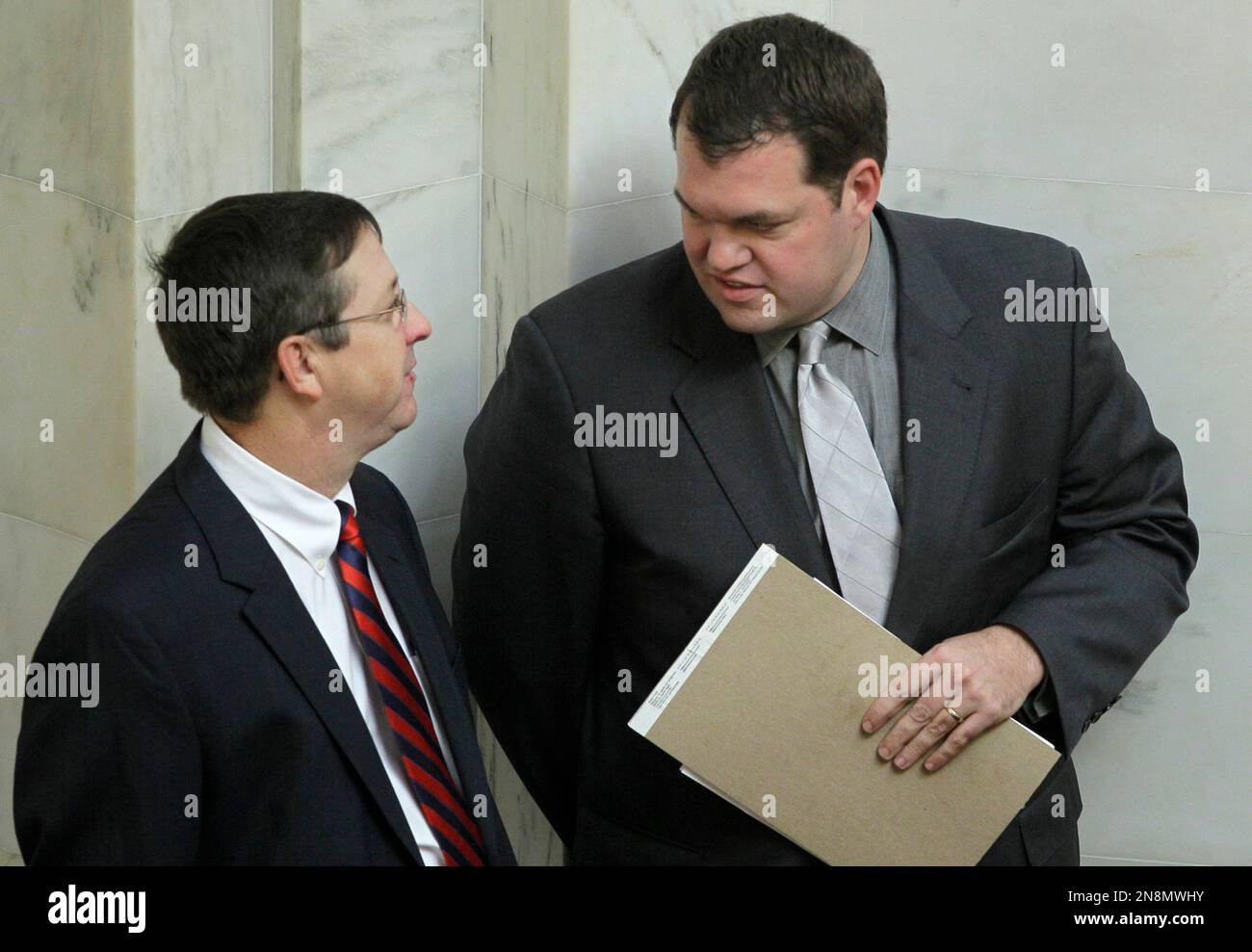 Sen. Michael Lamoureux, RRussellville, right, speaks with Sen. Larry Teague, DNashville, in