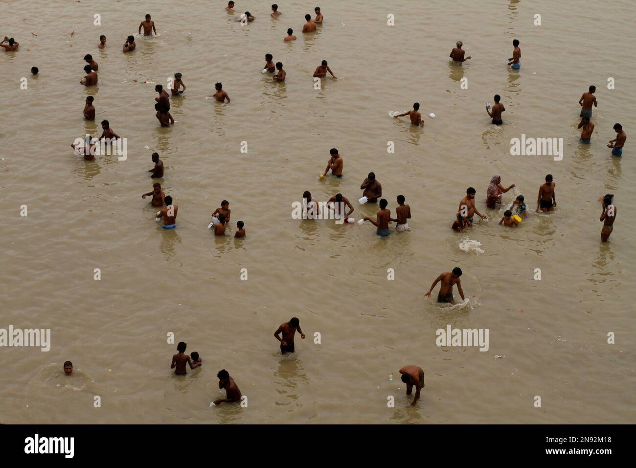 Indian Hindu devotees take holy dips in the River Ganges before they