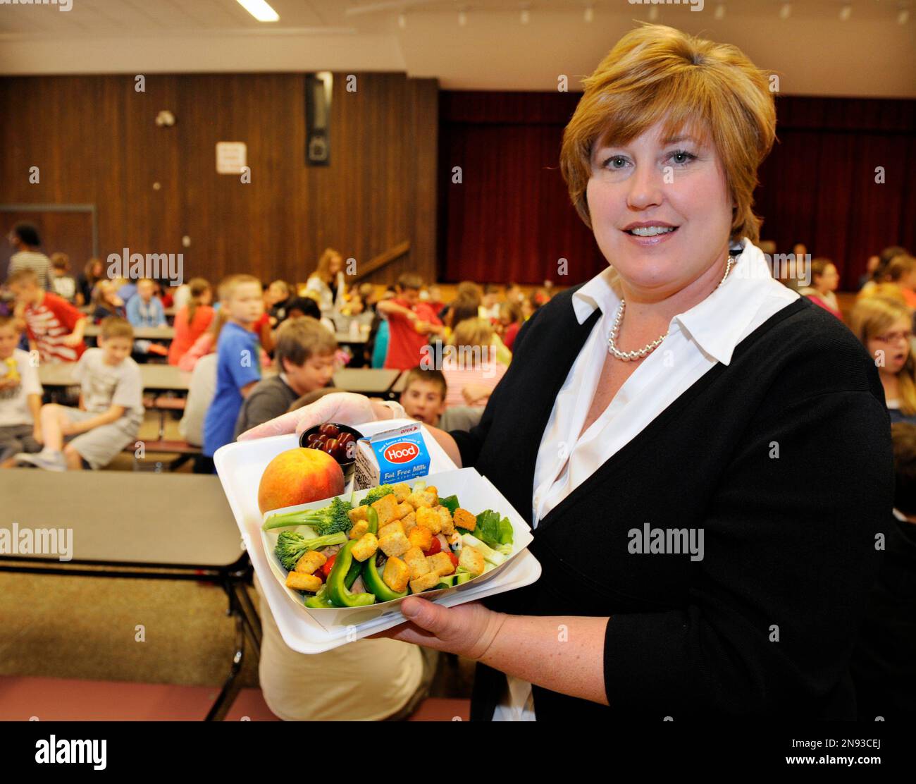 Food Service's Director Kim Gagnor, poses for a photograph with select healthy food items from