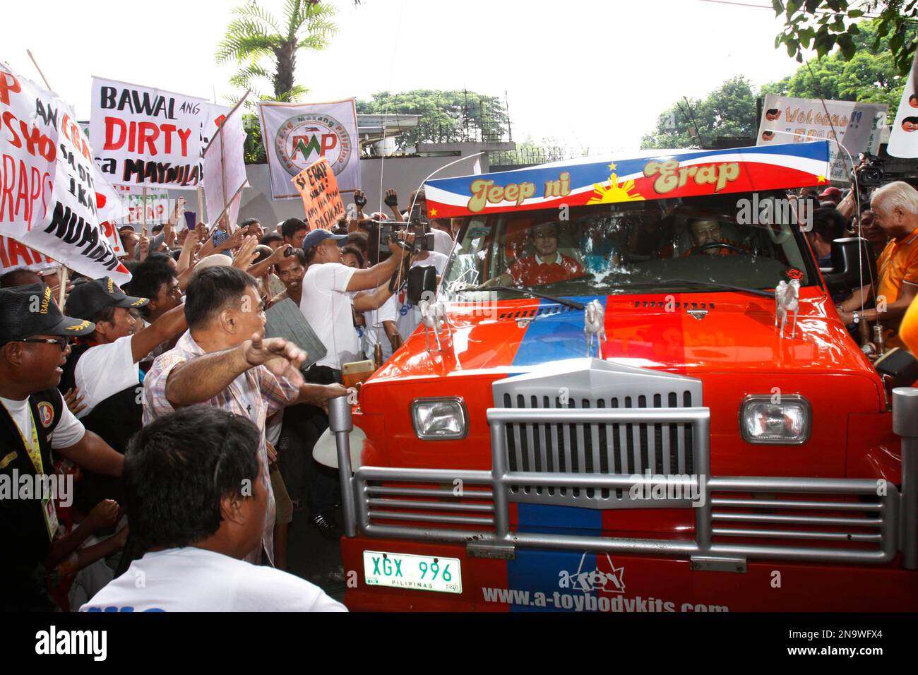 Former Philippine President Joseph Estrada drives his car named "Jeep