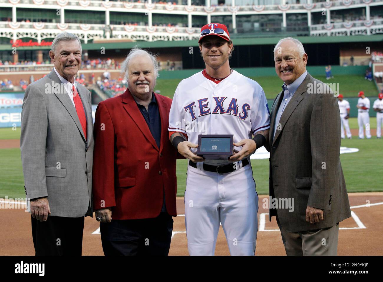 Texas Rangers owners Ray Davis, from left, Bob Simpson, outfielder Josh