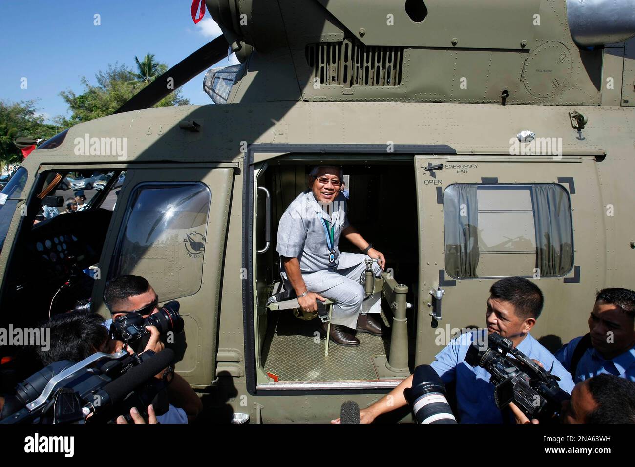 Philippine Defense Secretary Voltaire Gazmin sits on one of four brand