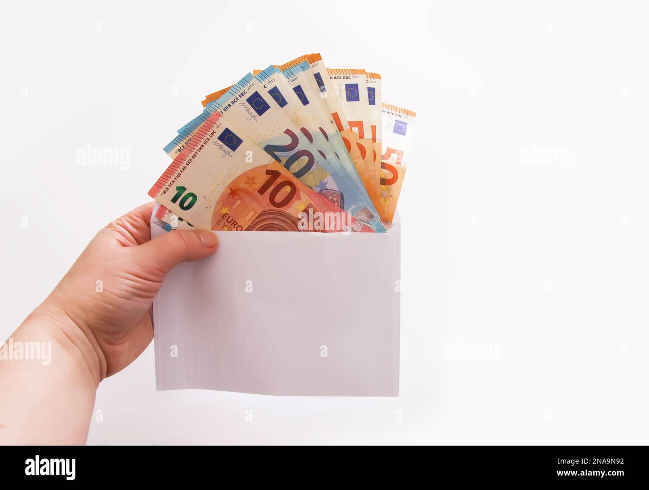 Cartera billetes de euro en una mano Fotografía de stock - Alamy