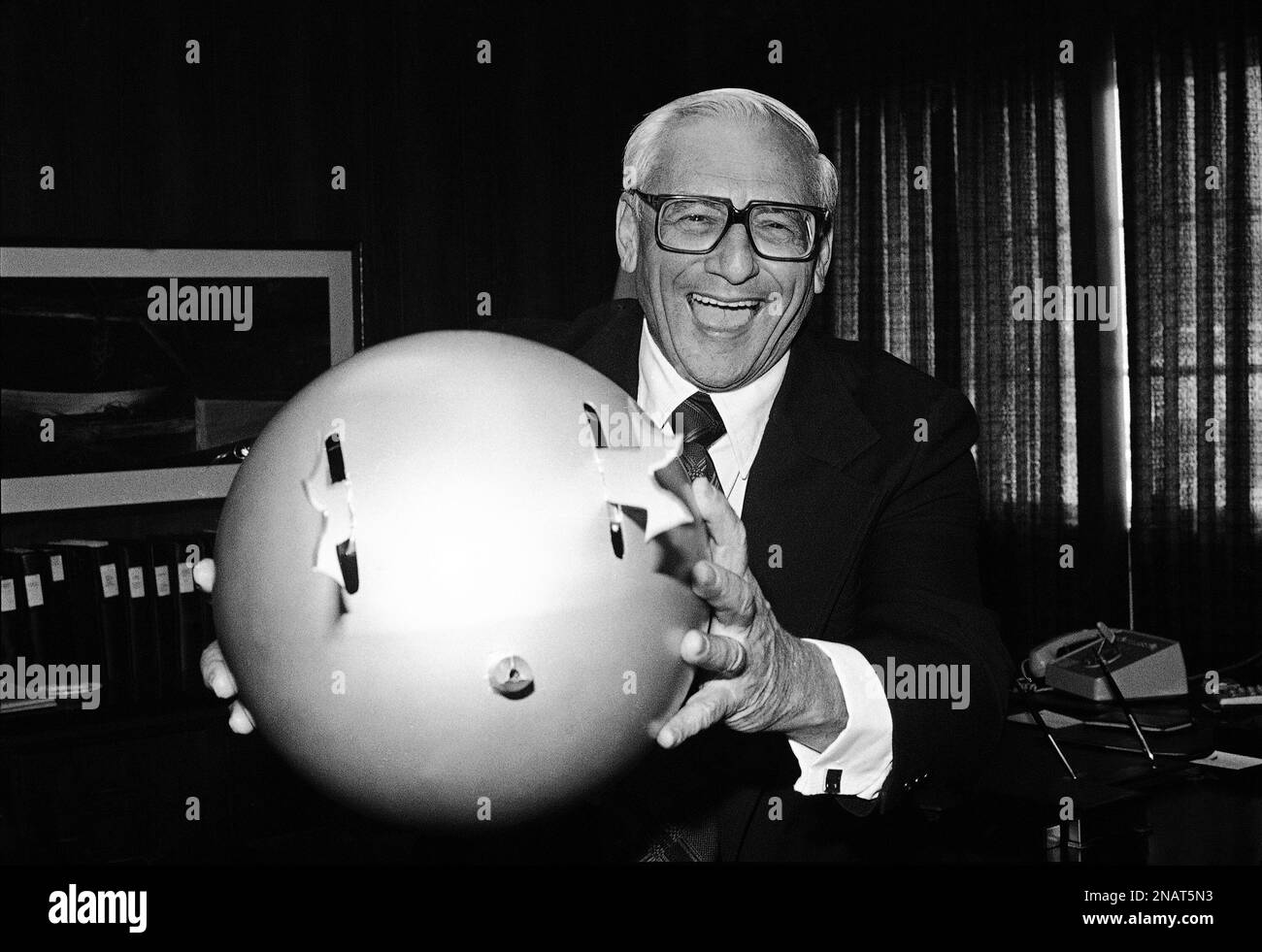 Avco Embassy President William Chaikin holds out his “killer ball” from