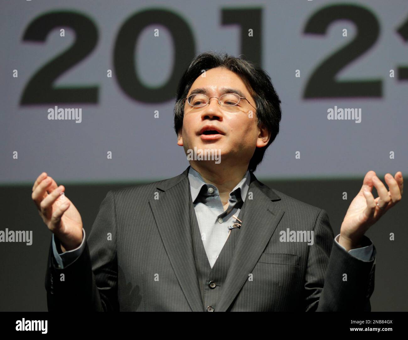 Nintendo President Satoru Iwata speaks during a news conference at a