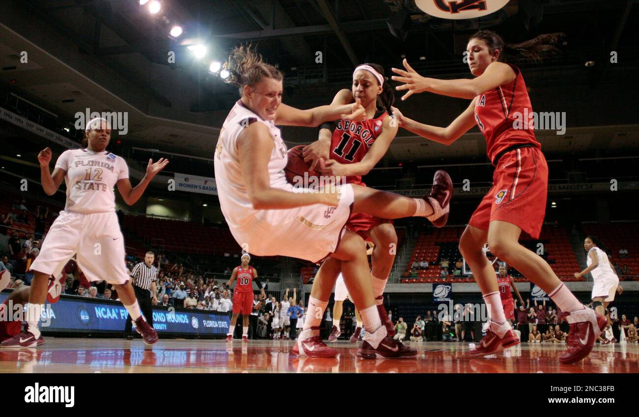 Florida State player Cierra Bravard, center, battles for a loose ball