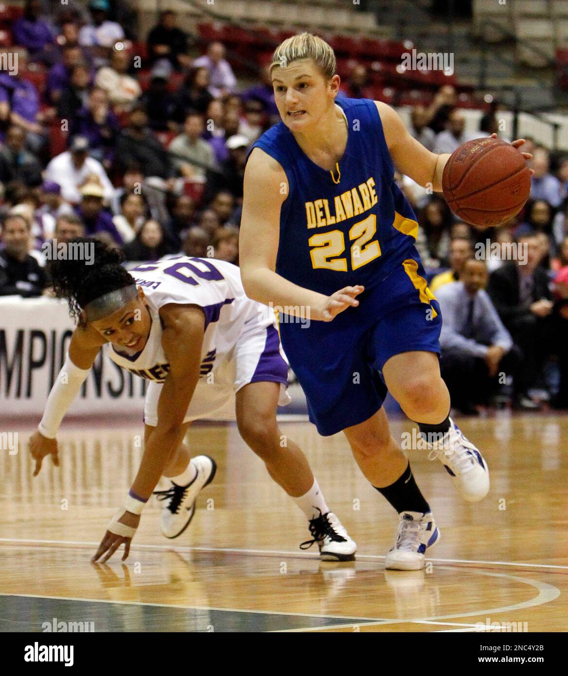 Delaware guard Lauren Carra (22) drives past James Madison guard Dawn