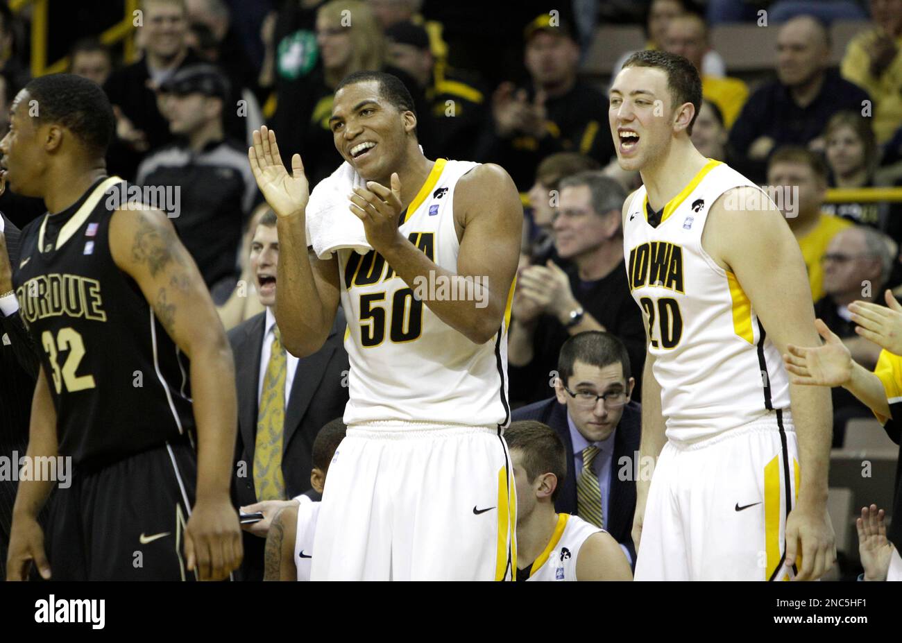 Iowa forward Jarryd Cole (50) and forward Andrew Brommer (20) look on