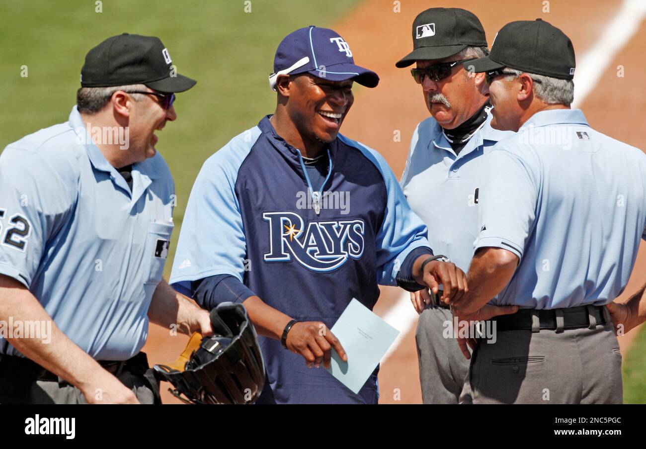 Tampa Bay Buccaneers head coach Raheem Morris, center, jokes with the