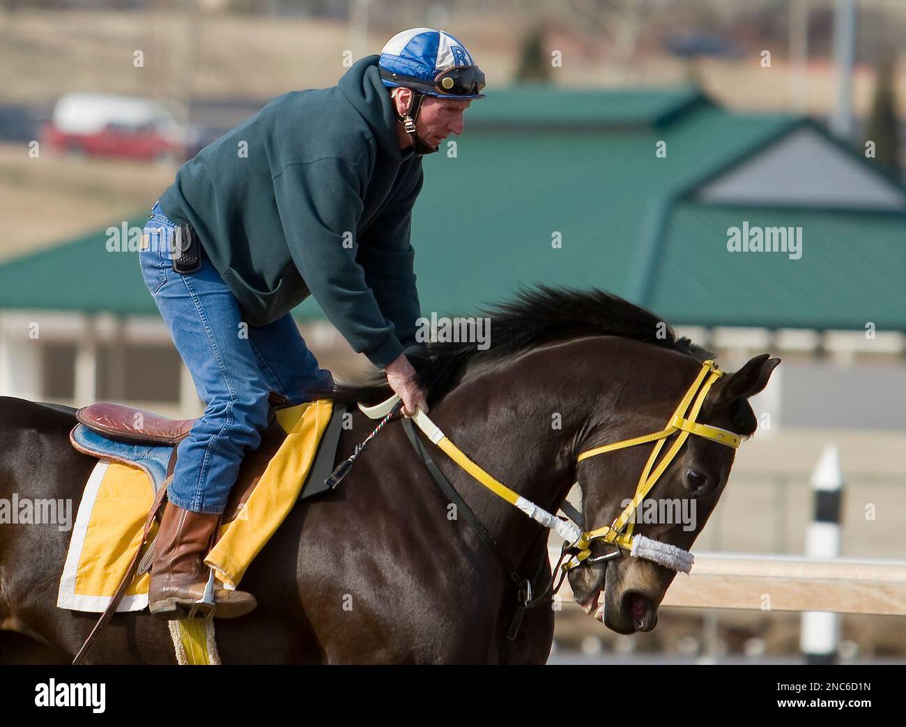 Jockey Roy Brooks goes for a morning trot on one of the race horses he
