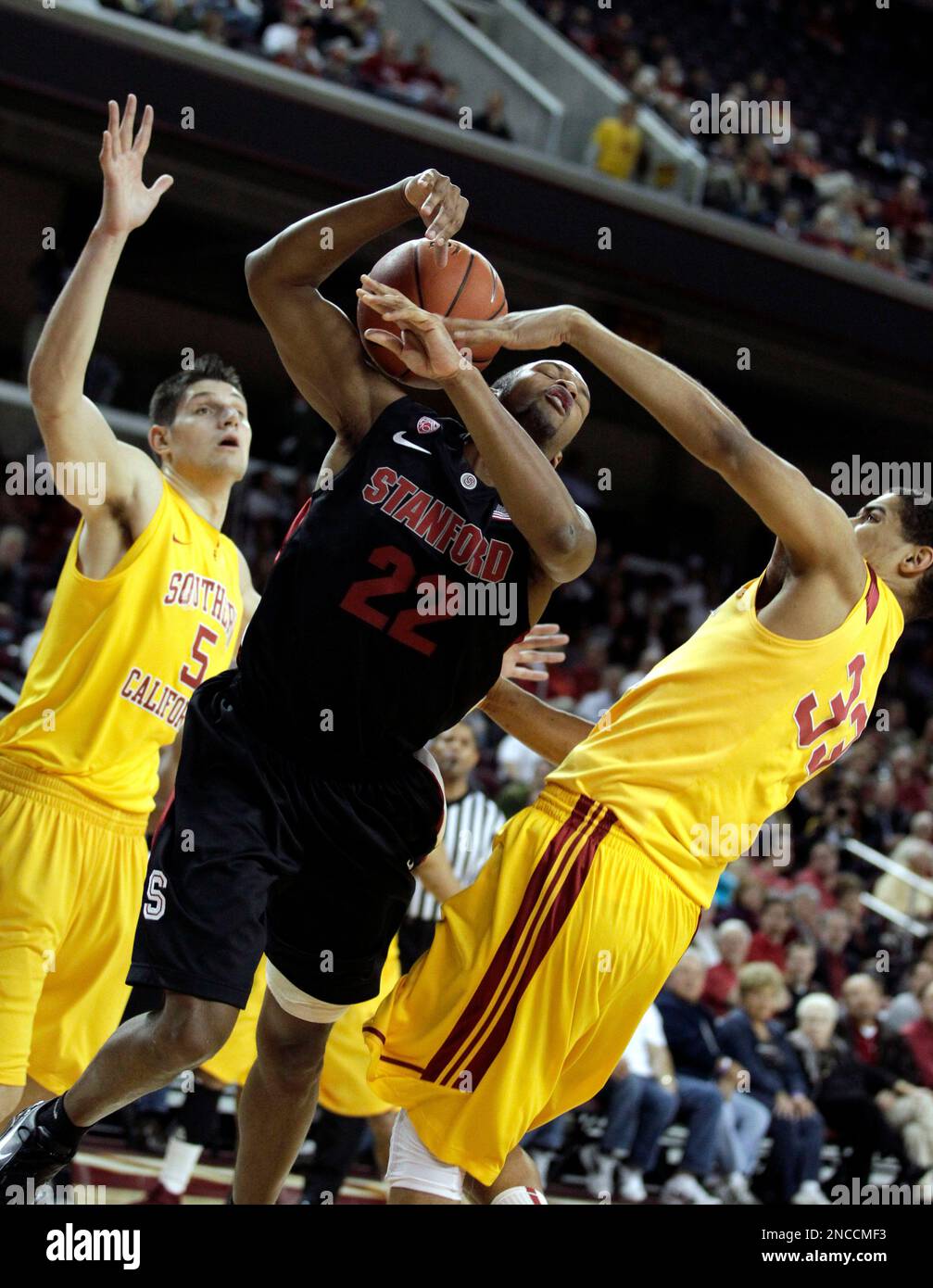 Stanford guard Jarrett Mann, center, goes up to shoot as Southern