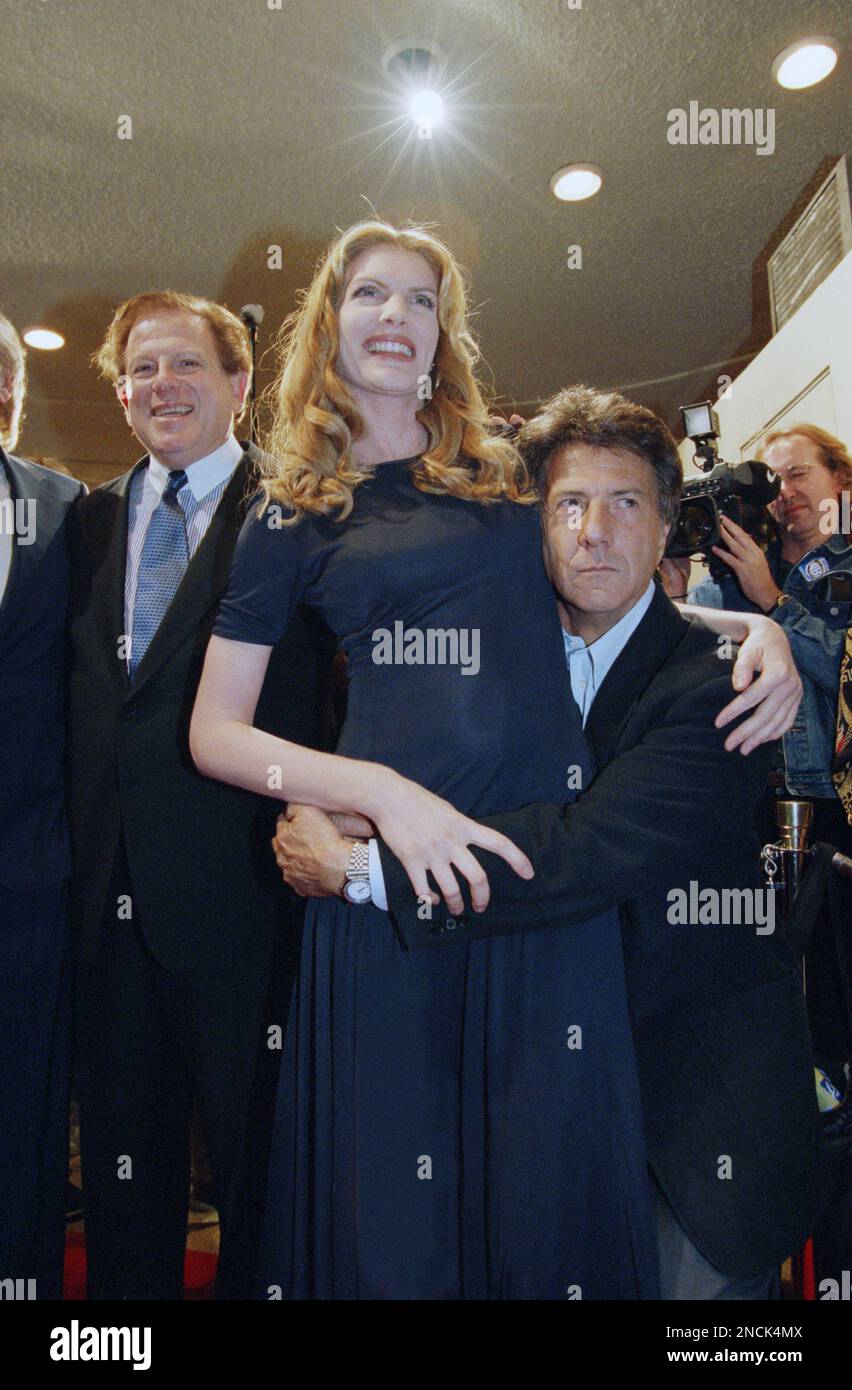 Stars of the movie “Outbreak”, Rene Russo and Dustin Hoffman pose for