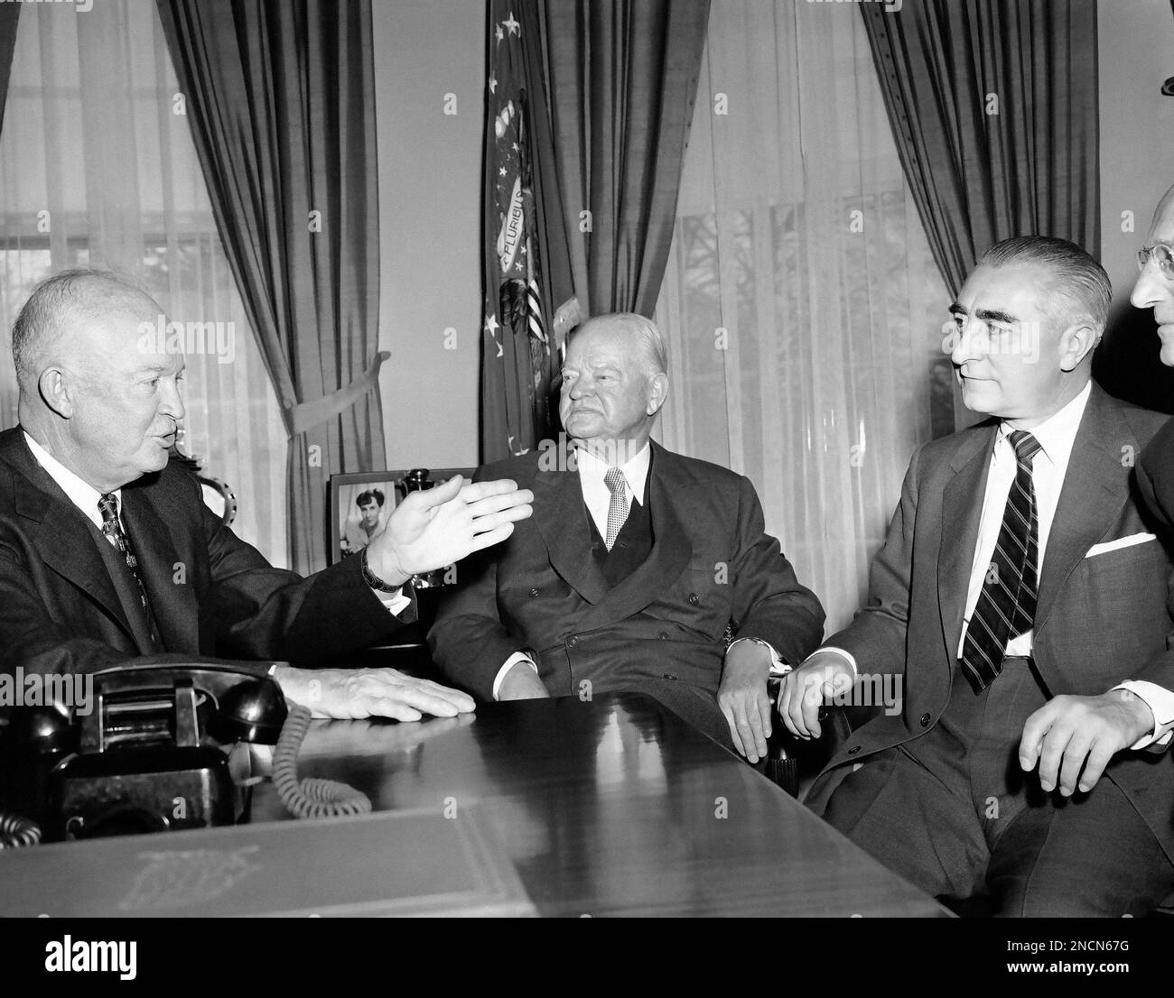 President Herbert Hoover looks toward President Dwight Eisenhower as