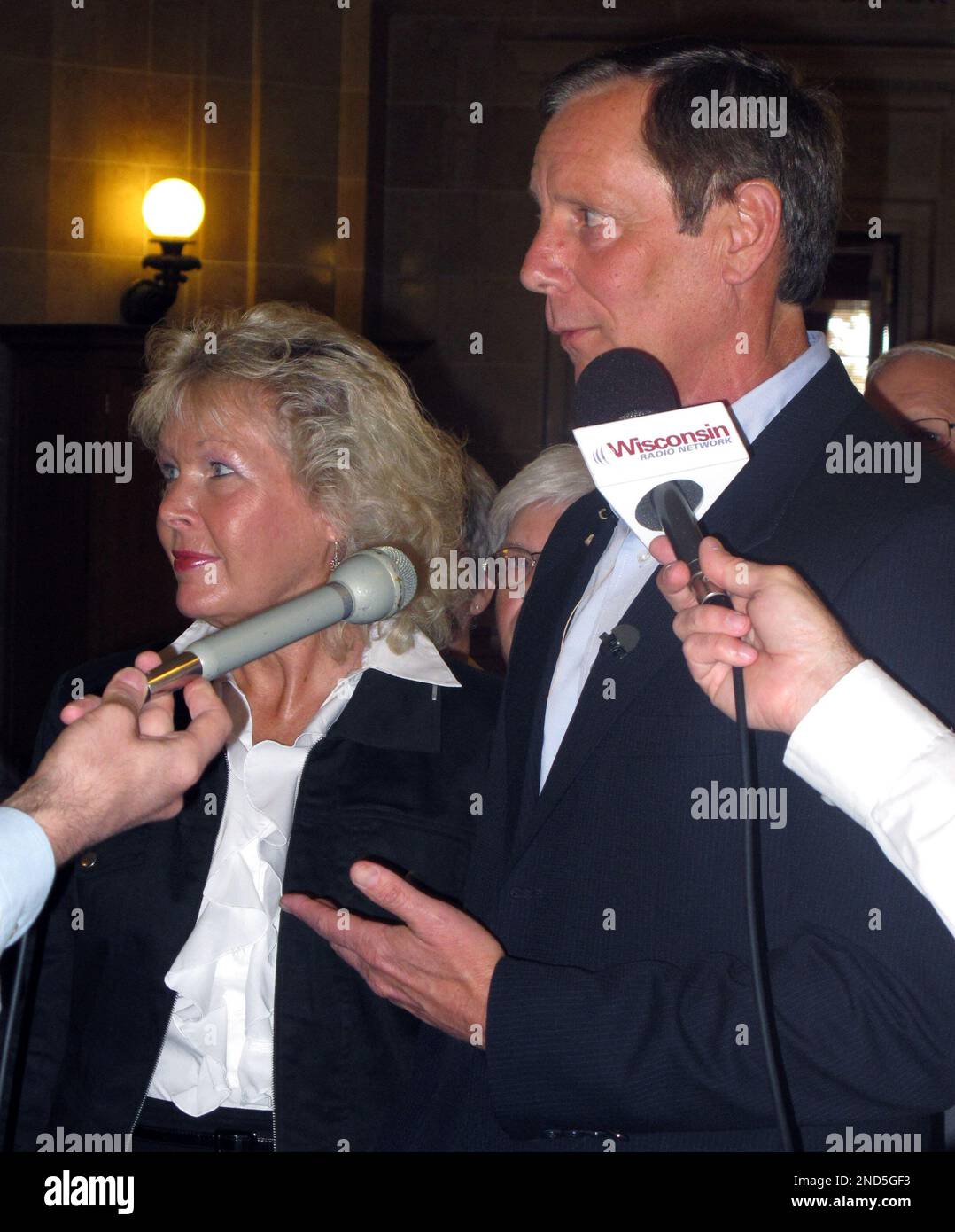 Wisconsin Republican candidate for governor Mark Neumann stands with