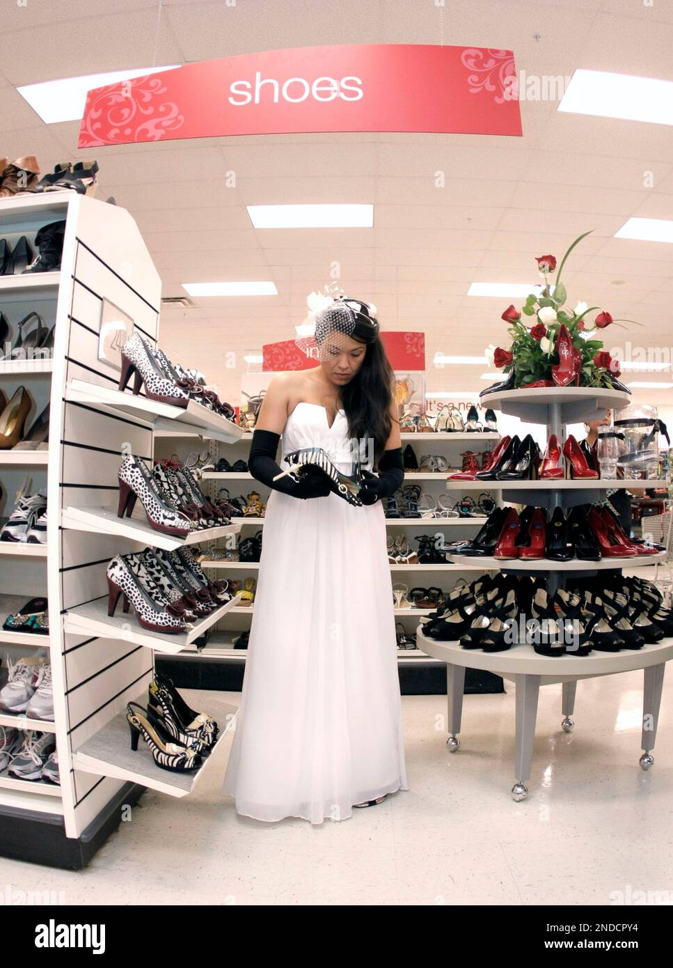 Selfproclaimed "Maxxinista" Bride Lisa Satayutlooks at a pair of shoes