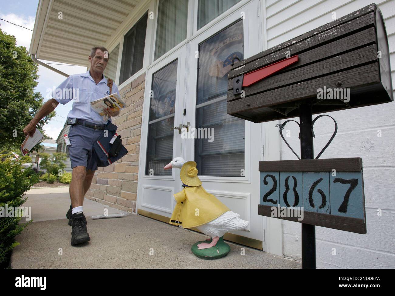 Ohio letter carrier Keith McVey walks his route delivering mail in