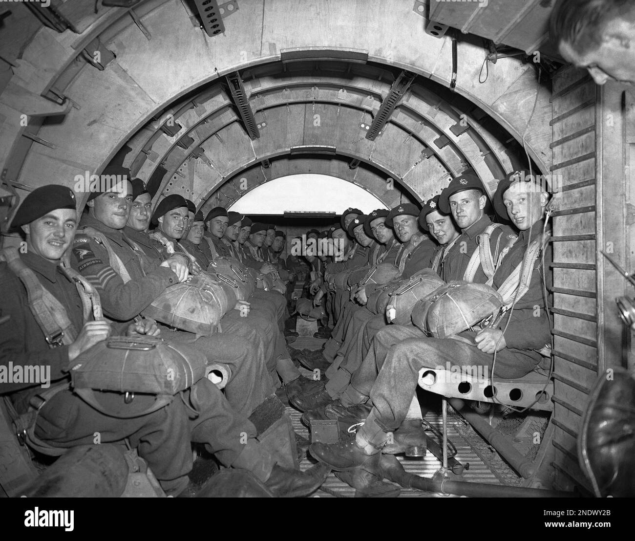 An interior view of a Horsa Glider with airborne troops ranged either