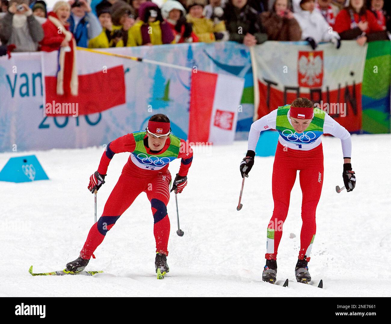 Poland's Justyna Kowalczyk, right, and Norway's Marit Bjoergen sprint