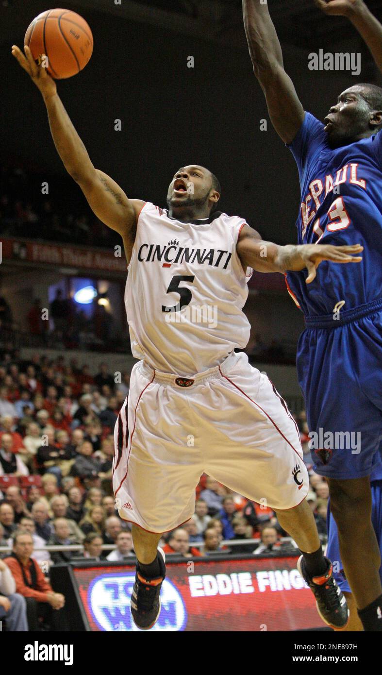 Cincinnati guard Deonta Vaughn (5) drives against DePaul forward Mac