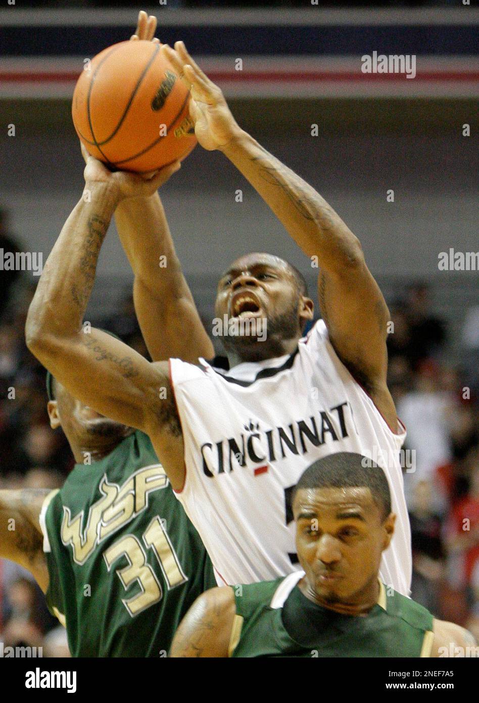 Cincinnati guard Deonta Vaughn (5) shoots between South Florida forward