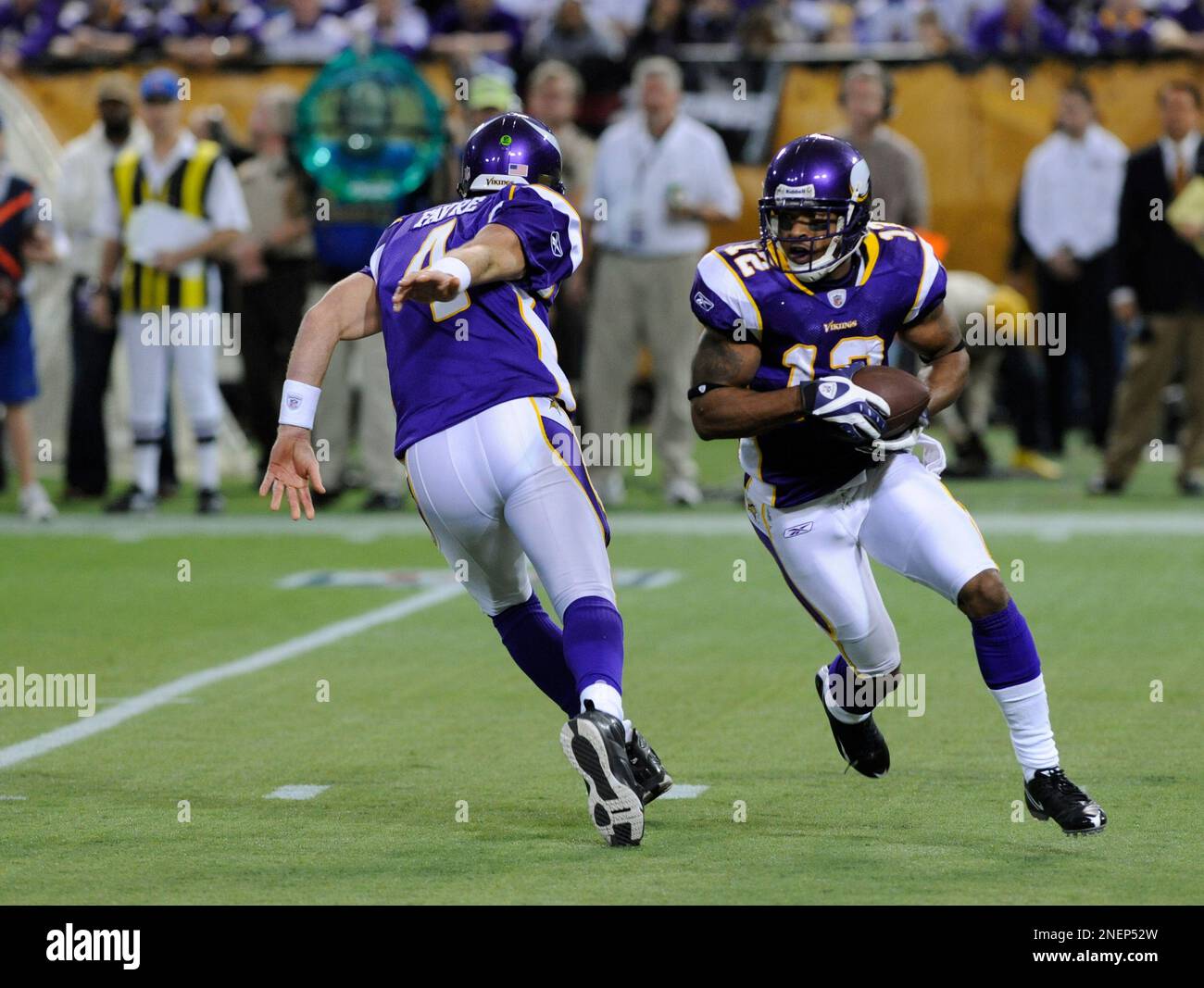 Minnesota Vikings quarterback Brett Favre rolls out in an NFL football game between the Vikings