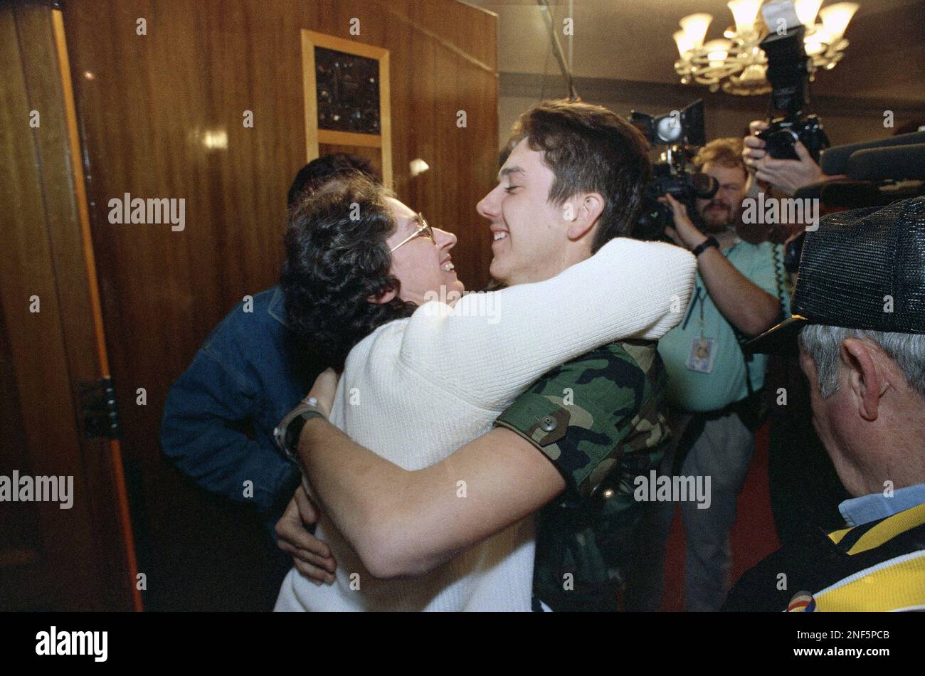 Ruth Dillow, left, of Chanute, Ks., hugs her son, U.S. Army Pfc