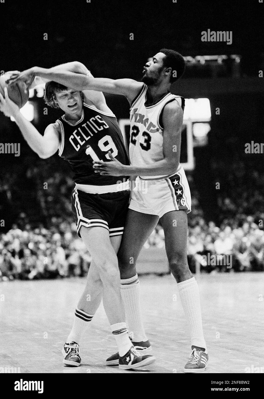 Boston Celtics Don Nelson (19) does his best to keep the ball away from