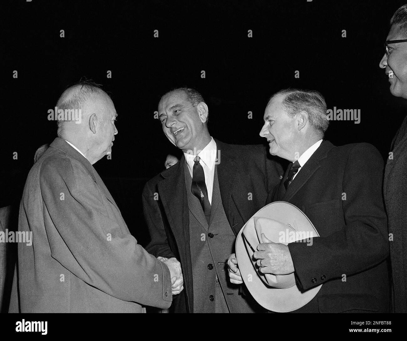 President Dwight Eisenhower, left, as he was greeted and to