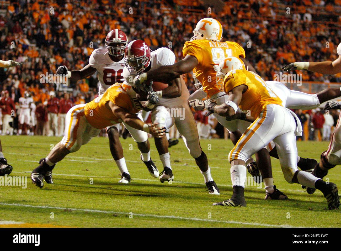 Alabama running back Roy Upchurch (5) fights his way for a touchdown