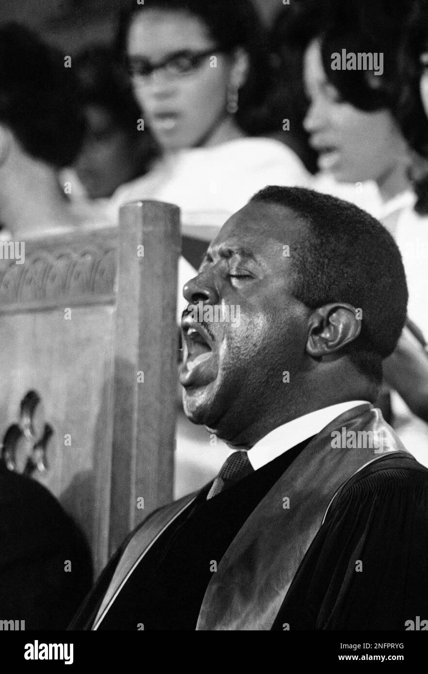 Civil rights leader Rev. Ralph Abernathy sings one of Dr. Martin Luther