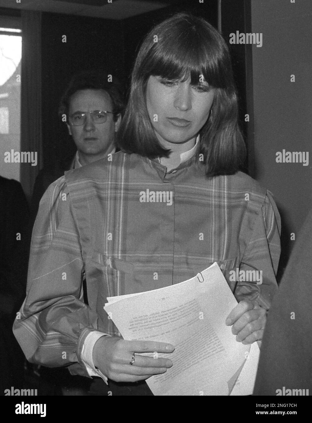 32-year-old Marianne Bachmeier, holds some files as she enters a