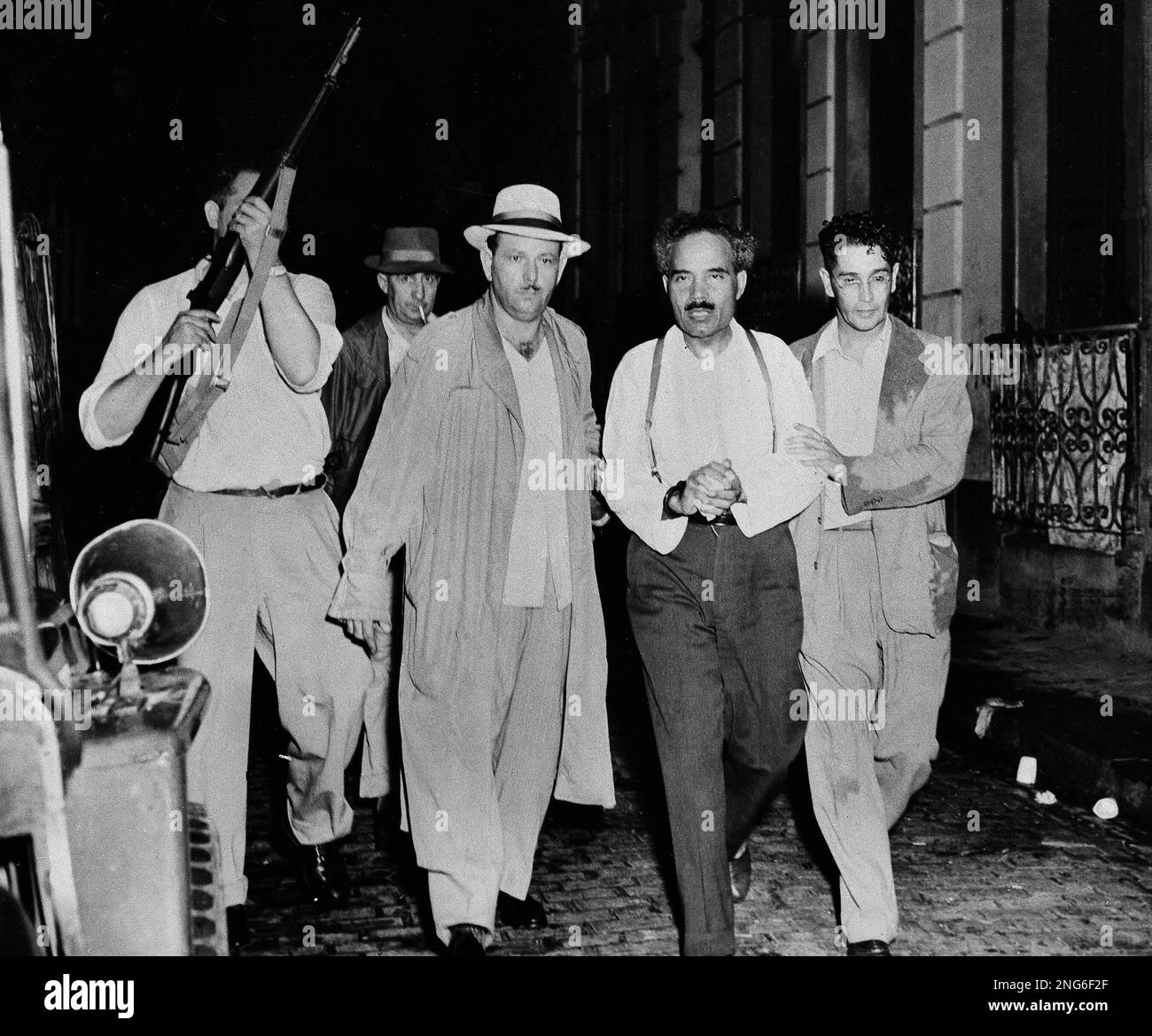 https://c8.alamy.com/compes/2ng6f2f/pedro-albizu-campos-president-of-the-puerto-rican-nationalists-was-routed-from-his-besieged-home-at-san-juan-puerto-rico-nov-2-1950-by-police-using-teargas-he-surrendered-without-a-shot-being-fired-and-was-whisked-to-headquarters-for-questioning-hours-after-the-washington-attempt-on-the-life-of-president-truman-other-top-leaders-of-the-nationalist-and-communist-parties-were-taken-in-a-widespread-roundup-campos-headed-a-nationalist-uprising-in-puerto-rico-which-started-oct-30-ap-photo-2ng6f2f.jpg